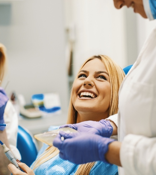 Woman laughing during preventive dentistry visit