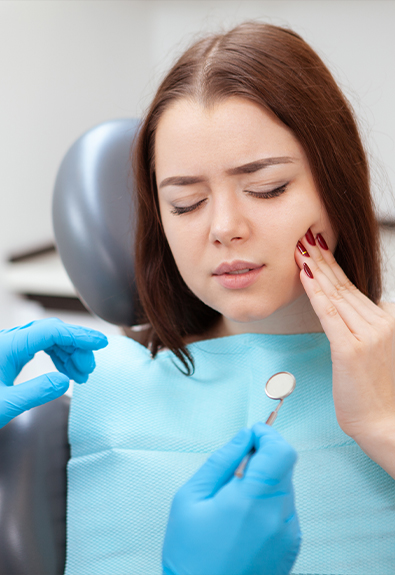 Woman in pain before emergency dentistry