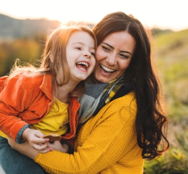 Mother and child smiling after children's dentistry