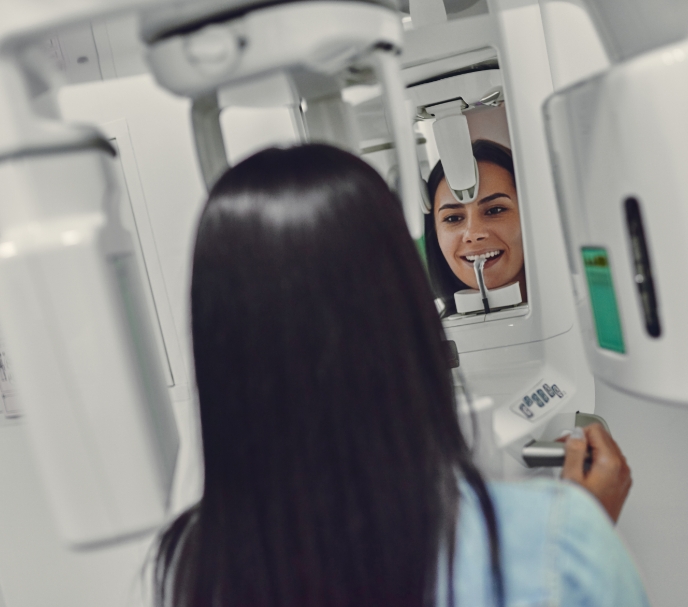 Woman receiving 3 D C T cone beam digital x ray scans