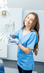 Smiling dental team member in treatment room