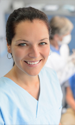 Friendly dental team member smiling