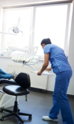 Dentist in dental treatment room