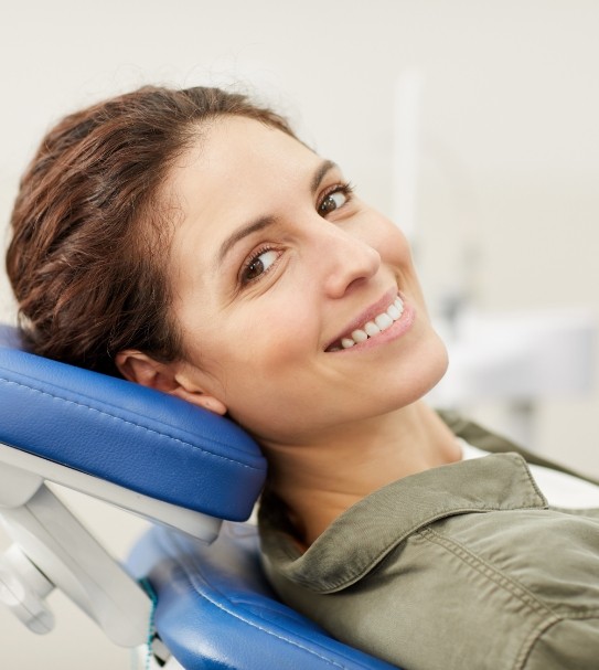 Woman smiling during dental appointment