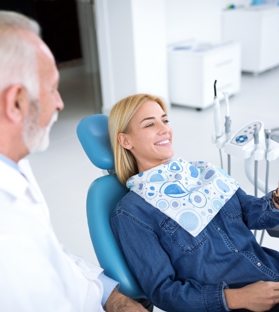 Dentist talking to dental patient