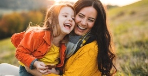 Mother and child smiling after children's dentistry visit