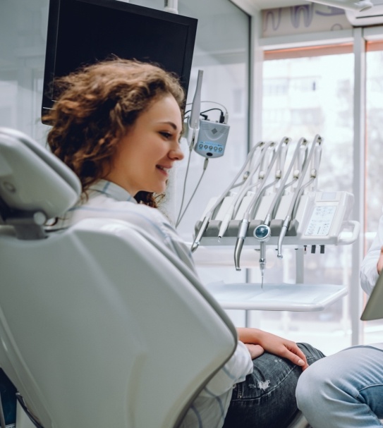 Dentist discussing cavity detection system with dental patient